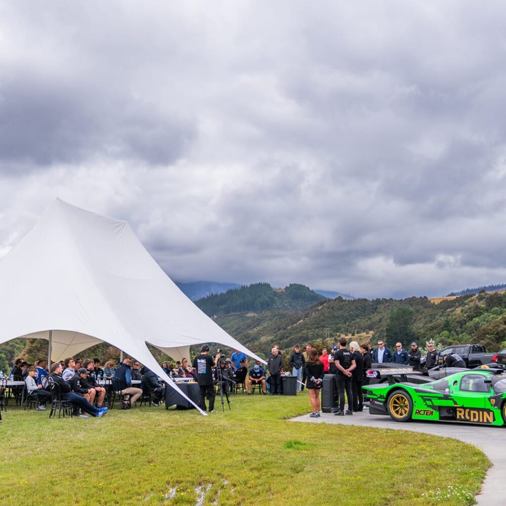 7-Guests_gather_outside_the_production_facilities